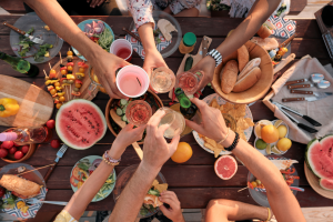Friends gathering in the spring for a picnic with healthy food items